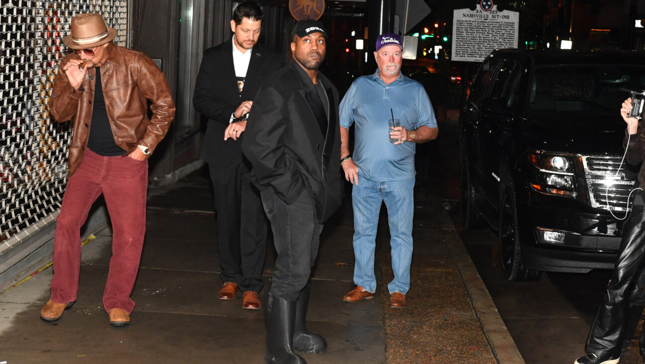 Kanye West, in one of his more understated pairs of large black boots.