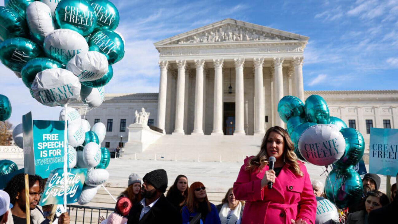 Lorie Smith, the owner of 303 Creative, a website design company in Colorado, speaks with supporters outside of the U.S. Supreme Court Building on December 05, 2022 in Washington, DC. 