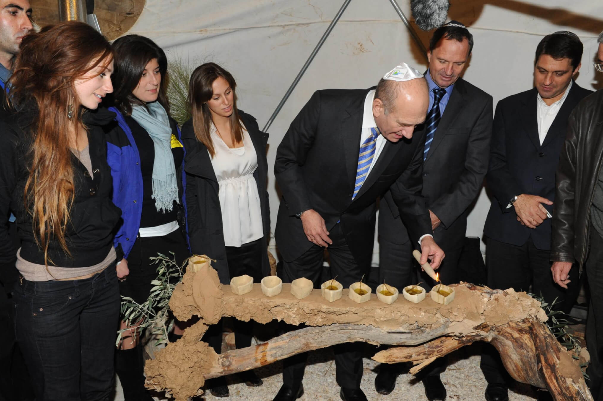 Then Israeli Prime Minister Ehud Olmert lights Hannukah candles on Dec. 25, 2008, in Modi'in, Israel. 