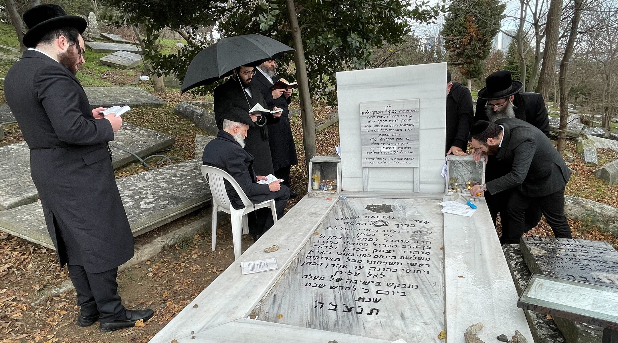 Haredi Orthodox pilgrims pray at the grave of Rabbi Naphtali Tzvi Katz, a 17th-century Kabbalist, in the Ortakoy neighborhood of Istanbul, Jan. 17, 2023. (David I. Klein)