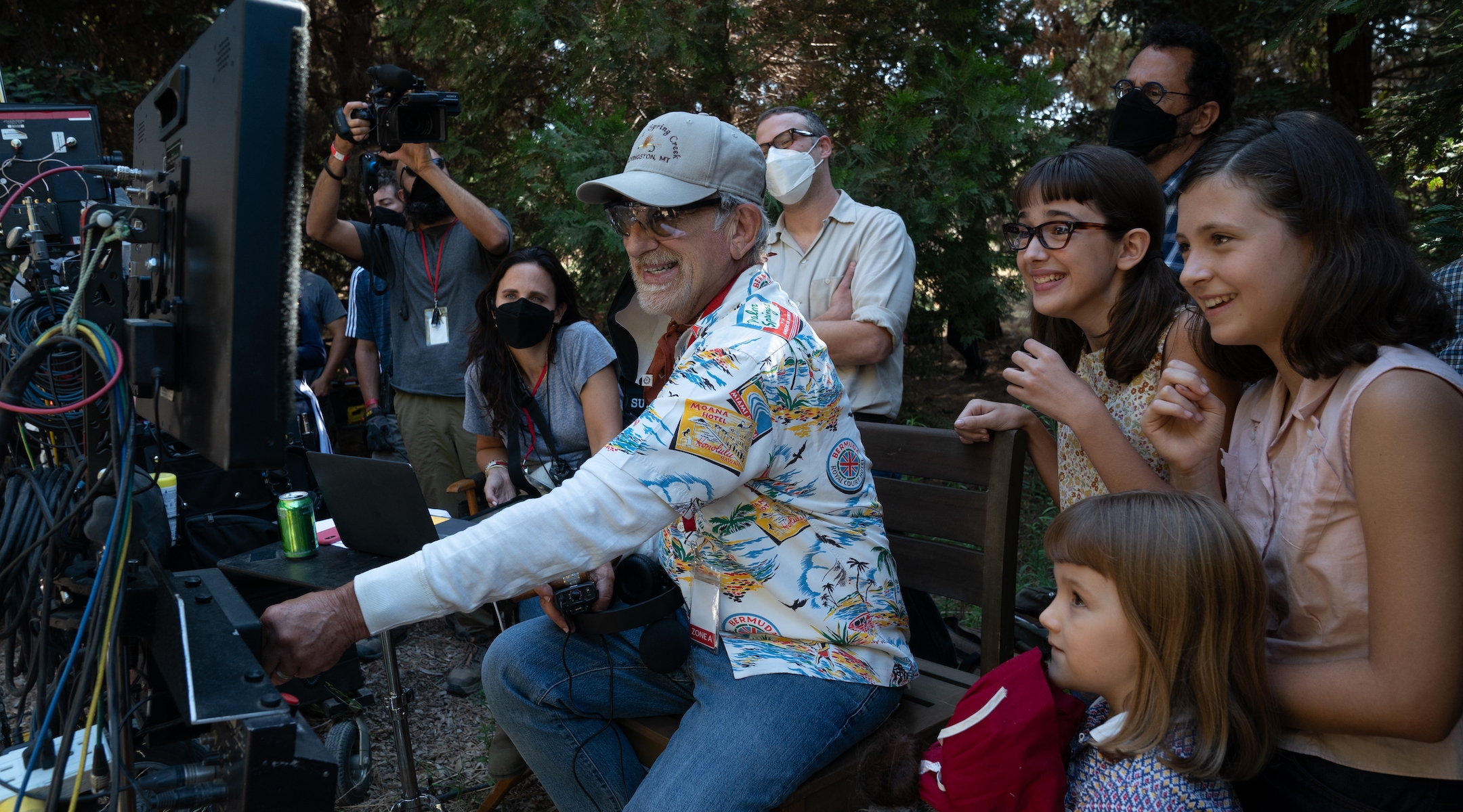 (from left) Producer Kristie Macosko Krieger, co-writer/producer/director Steven Spielberg, Seth Rogen, Julia Butters, co-writer/producer Tony Kushner, Keeley Karsten and Sophia Kopera on the set of “The Fabelmans.” (Merie Weismiller Wallace/Universal Pictures and Amblin Entertainment)