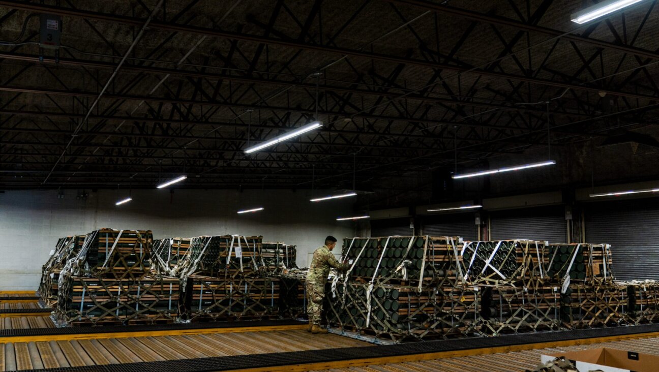 A U.S. airman prepares weaponry bound for Ukraine at a storage bunker at Dover Air Force Base in Dover, Delaware, Oct. 12, 2022. The U.S. is also sending weapons from stockpiles in Israel and South Korea.(Demetrius Freeman/The Washington Post via Getty Images)