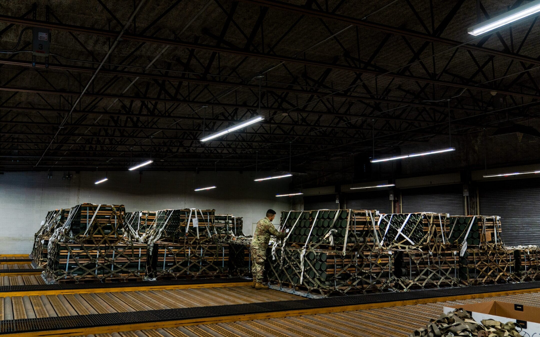 A U.S. airman prepares weaponry bound for Ukraine at a storage bunker at Dover Air Force Base in Dover, Delaware, Oct. 12, 2022. The U.S. is also sending weapons from stockpiles in Israel and South Korea.(Demetrius Freeman/The Washington Post via Getty Images)