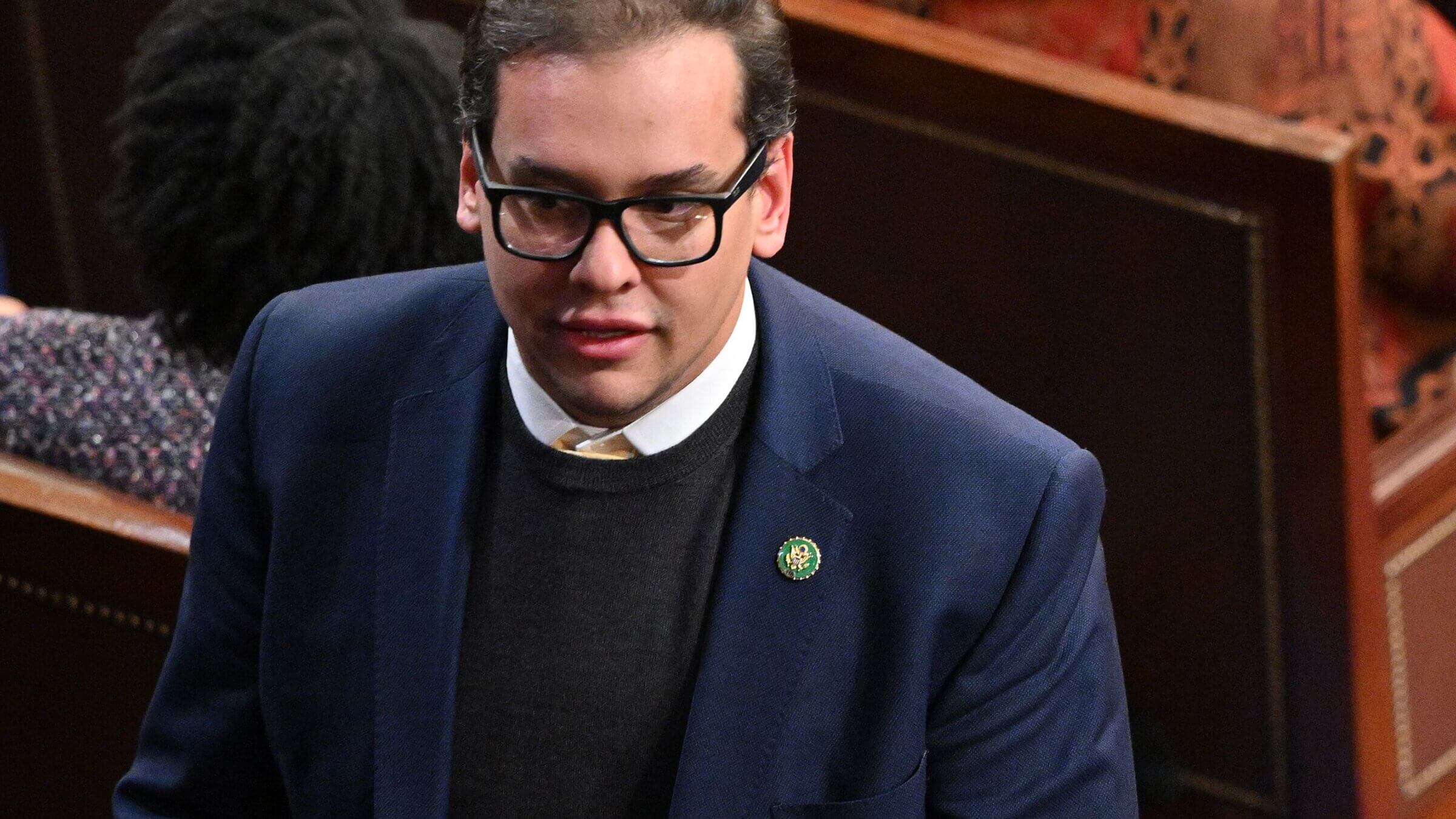 Rep. George Santos (R-NY) walks through the House Chamber Jan. 5, 2023.