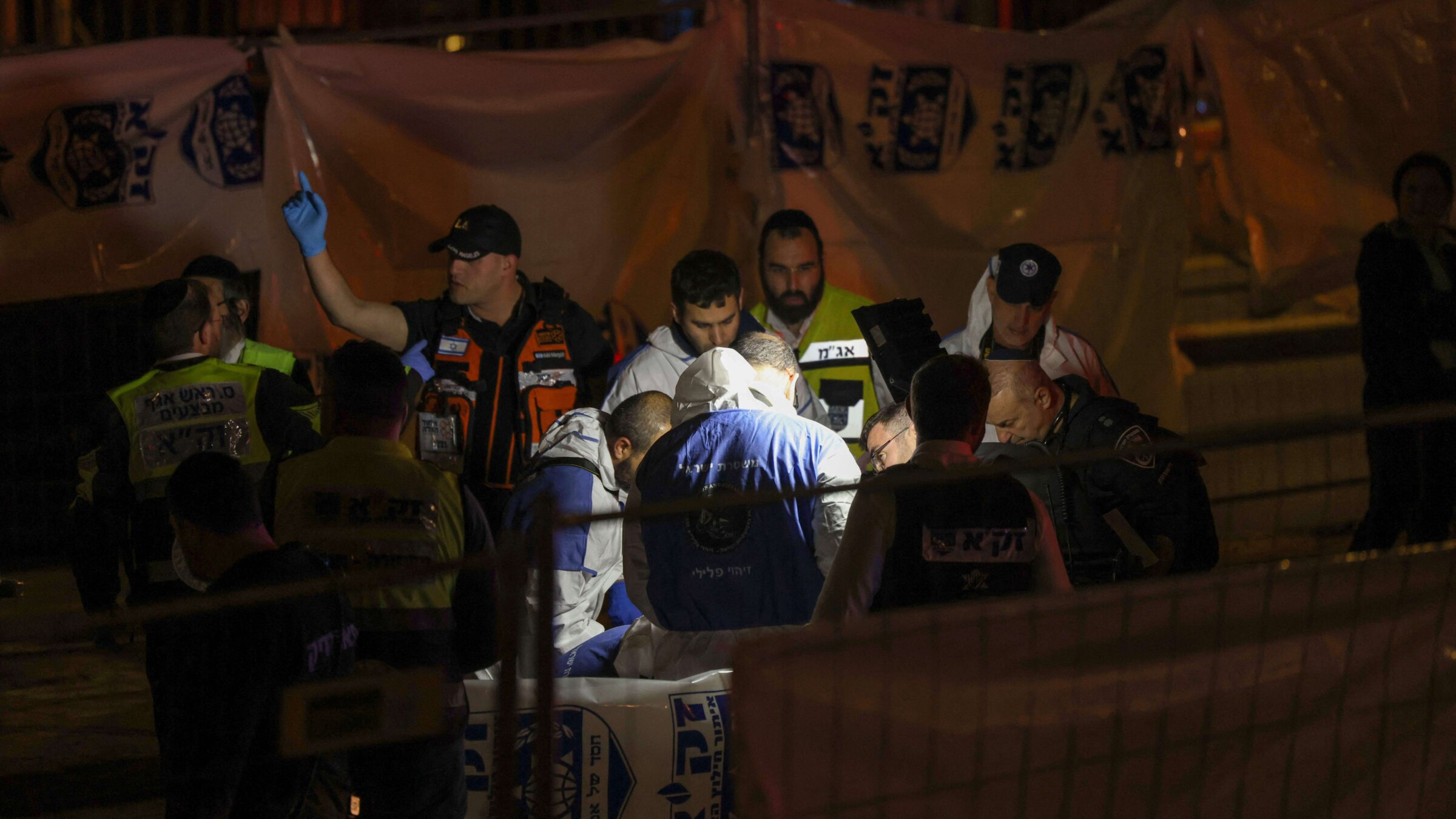 Israeli personnel work at the site of a reported attack in East Jerusalem.