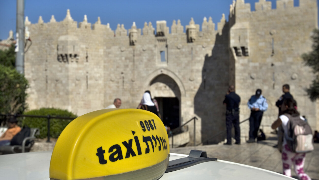 A taxi waits outside Damascus Gate in Jerusalem.