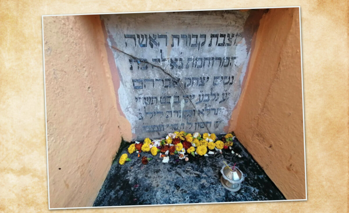 Marigold flowers and incense placed by Hindu worshipers at the grave of Geula, in Kolkata, India.