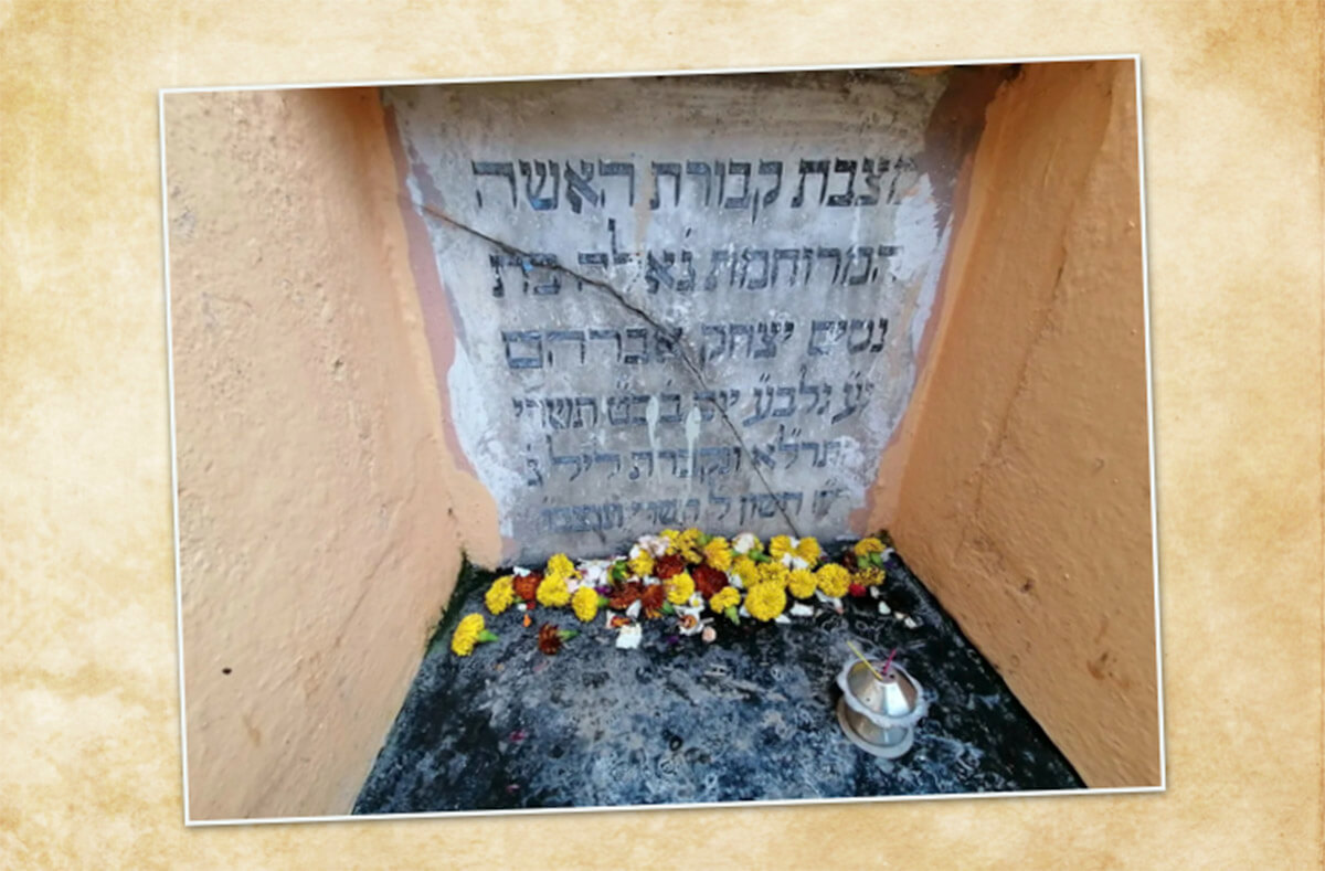 Marigold flowers and incense placed by Hindu worshipers at the grave of Geula, in Kolkata, India.