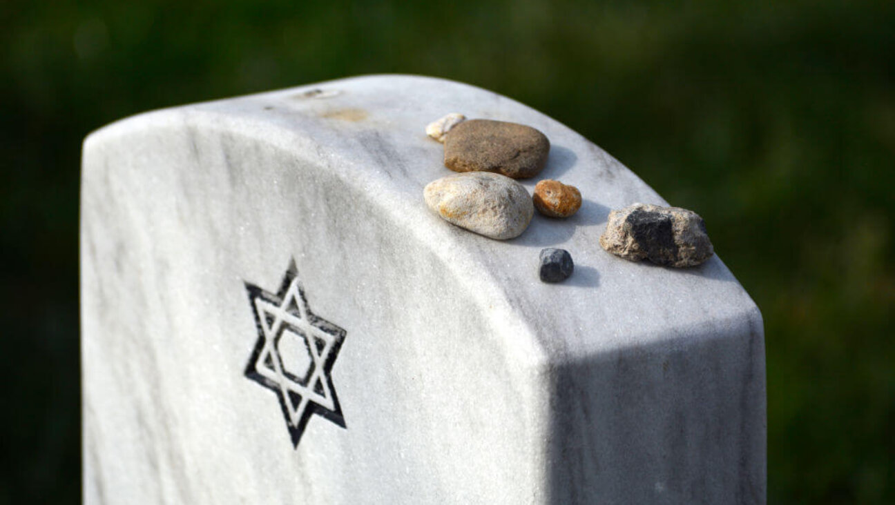 Stones placed by visitors on top of the tombstone of a Jewish U.S. military and World War II veteran at Arlington National Cemetery, April 22, 2018.