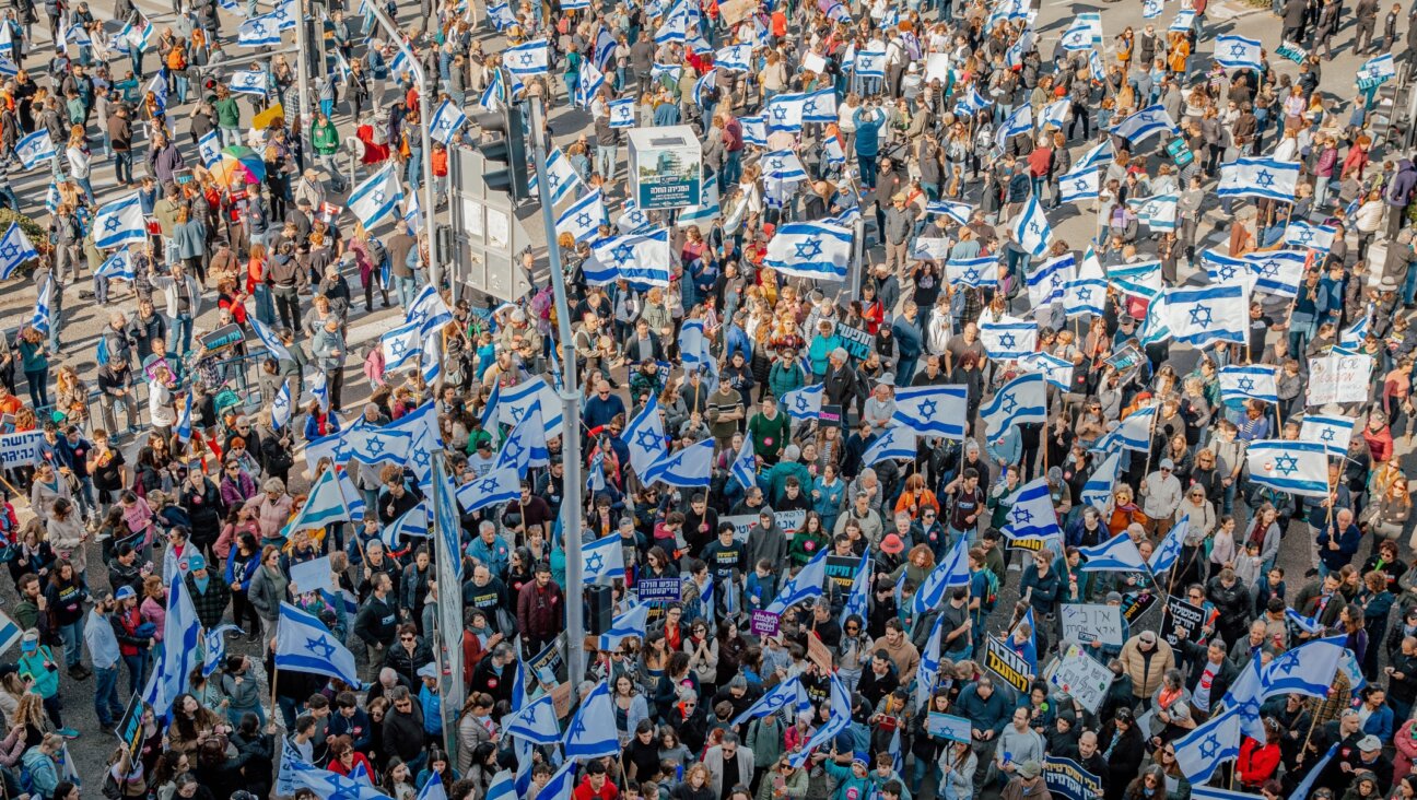 Israelis protest against the proposed changes to the legal system in Haifa, on February 20, 2023. (Shir Torem/Flash90)