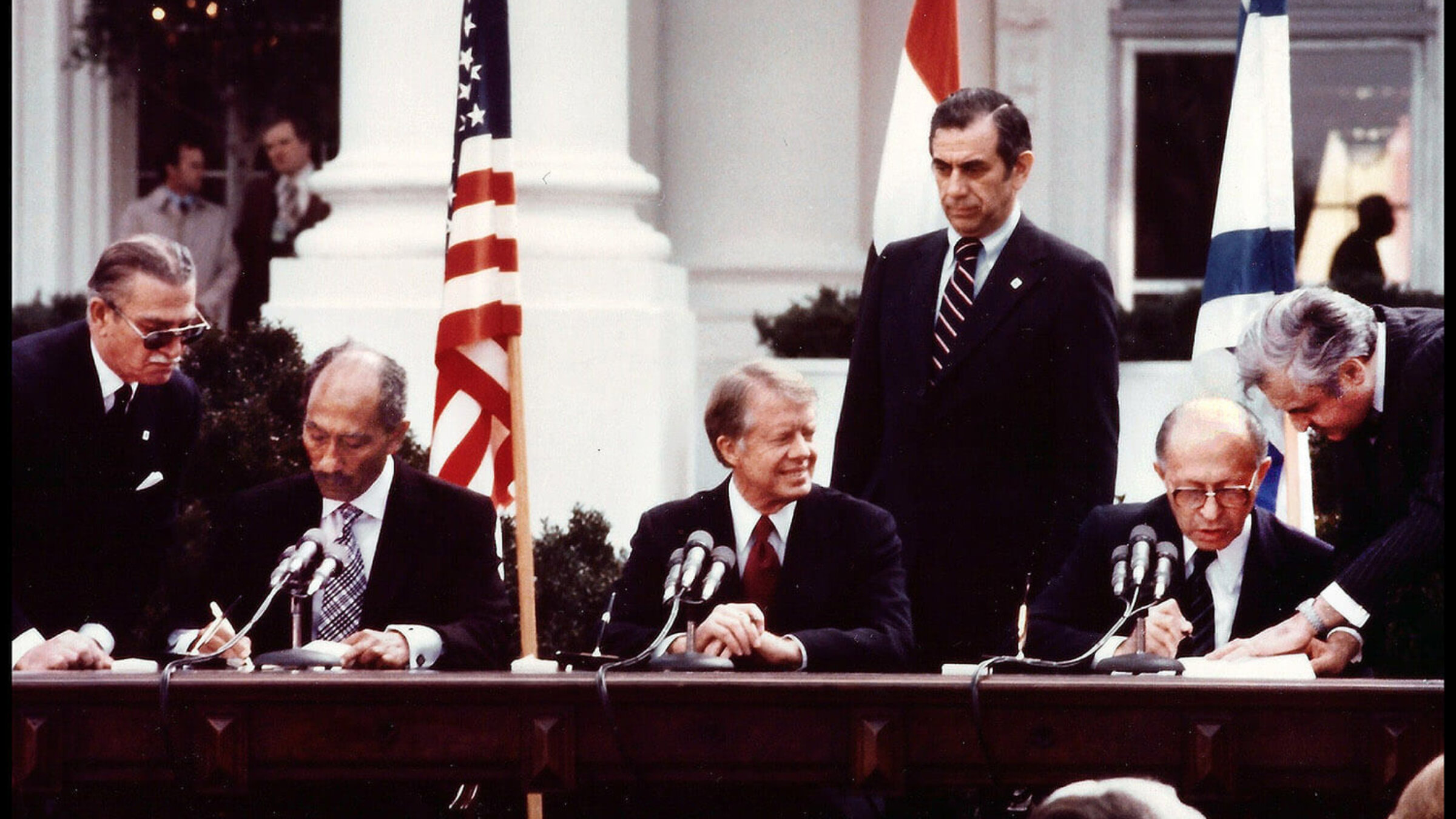 Jimmy Carter, Egypt's President Anwar Sadat and Israel's Prime Minister Menachem Begin sign the Egyptian-Israeli Peace Treaty at the White House on March 26, 1979.