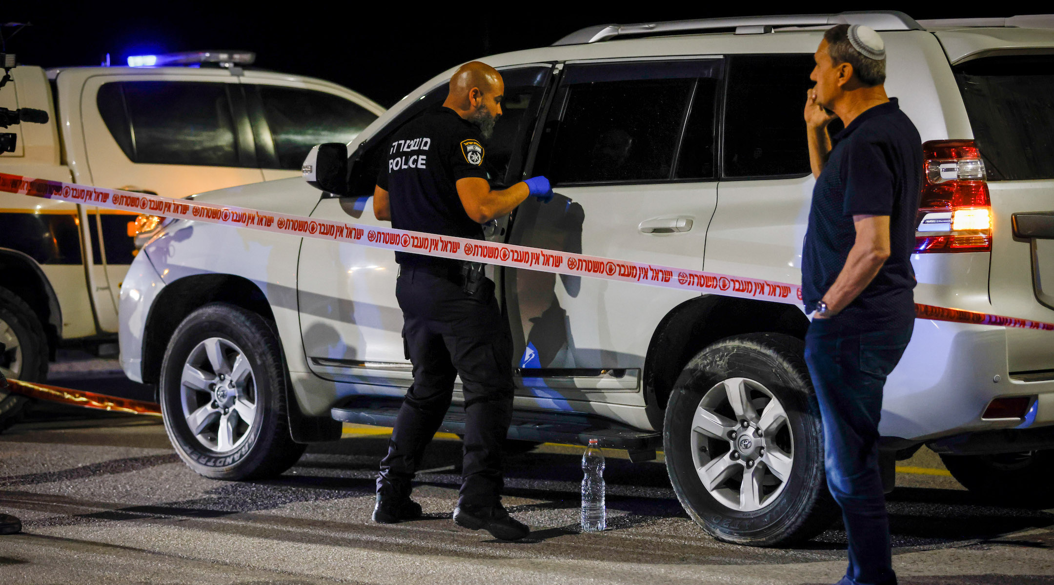 Israeli security forces guard the scene of a shooting attack near Jericho on February 27, 2023. (Erik Marmor/Flash90)