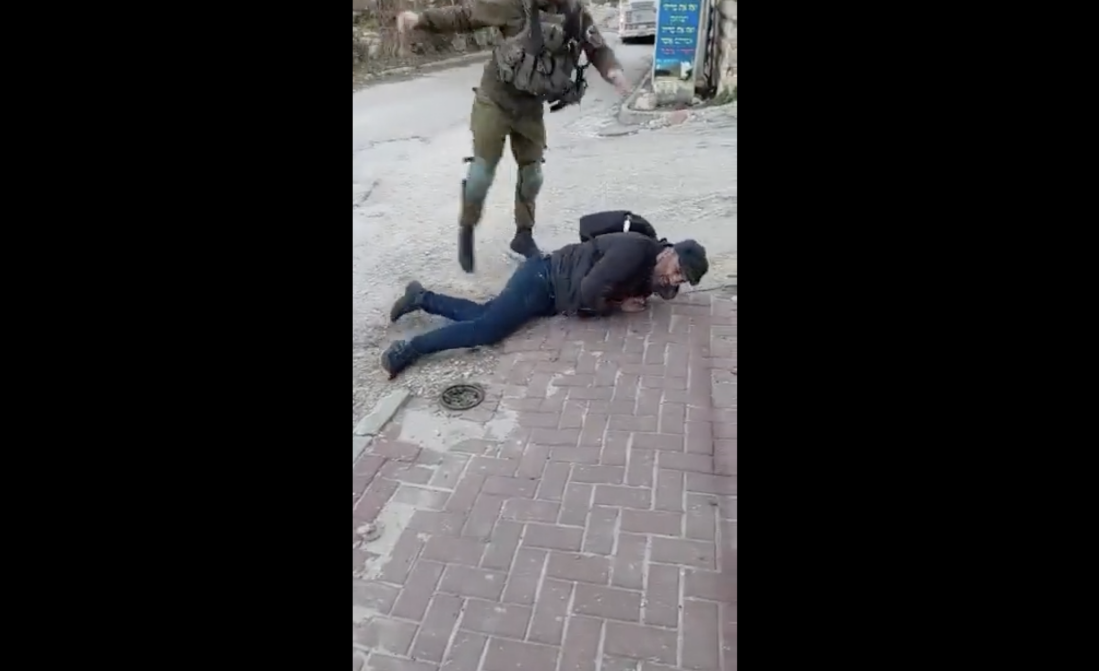 A video showing an Israeli soldier throwing a Palestinian activist to the ground and kicking him went viral, resulting in the soldier being jailed for 10 days. (Screenshot)