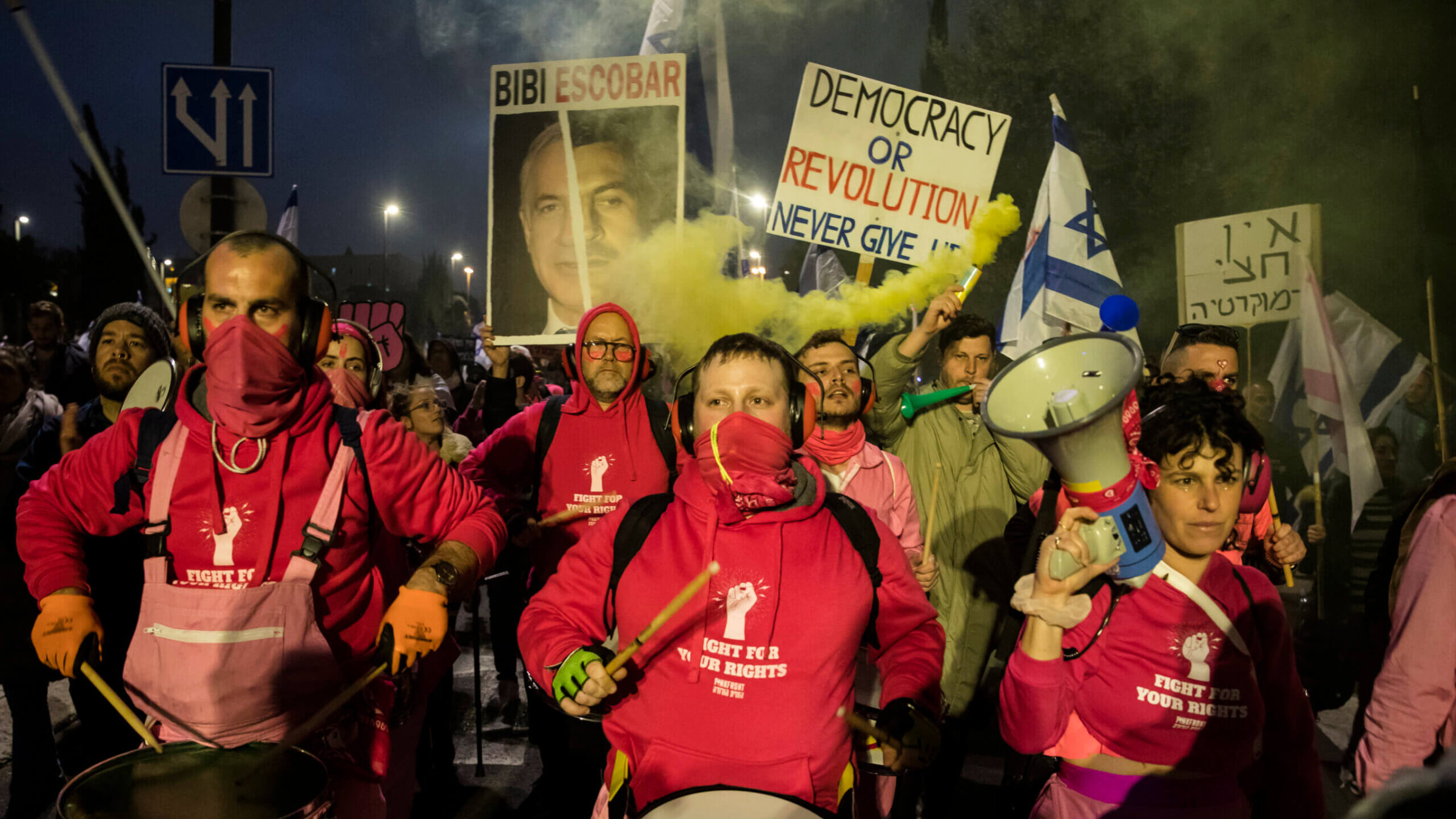 Protesters march as tens of thousands of Israelis attend a demonstration against the government's judicial plans on February 20, 2023 in Jerusalem, Israel. 