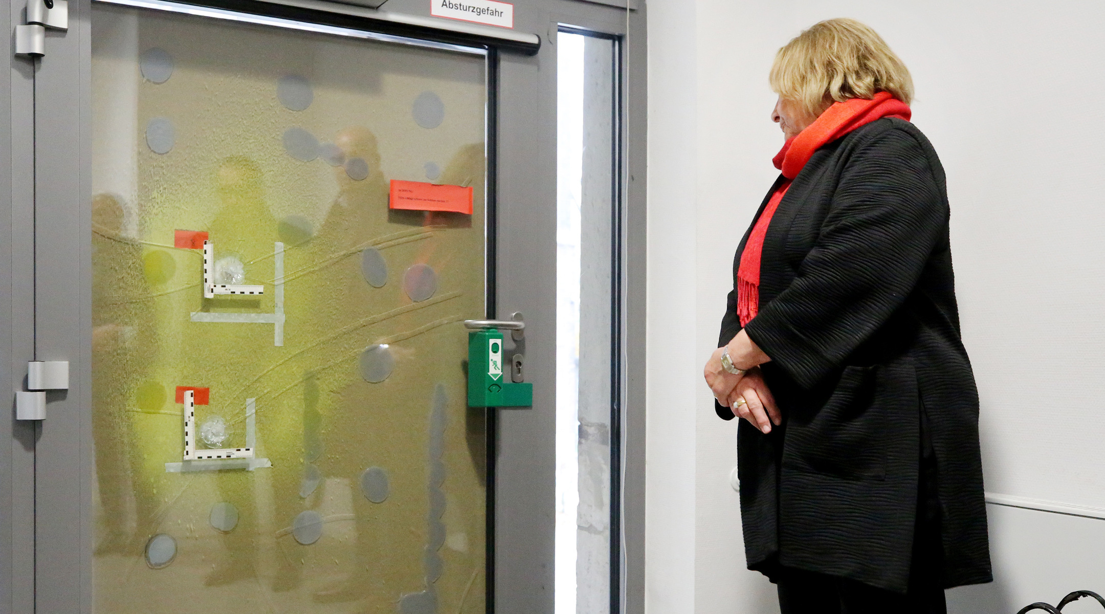 Sabine Leutheusser-Schnarrenberger, the anti-Semitism commissioner of North Rhine-Westphalia, Surveys the Bullet holes on the door of Essen’s Old Synagogue. (Photo by Roland Weihrauch/picture alliance via Getty Images)