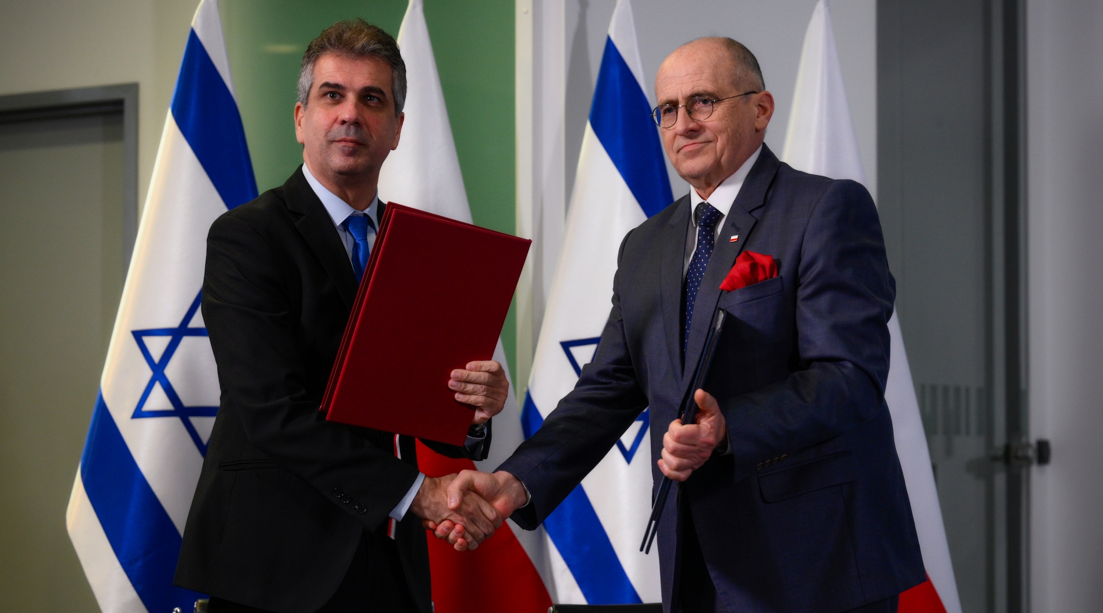 Israeli Foreign Minister Eli Cohen, left, meets with Polish Foreign Minister Zbigniew Rau in Warsaw, March 22, 2023. (Jaap Arriens/NurPhoto via Getty Images)