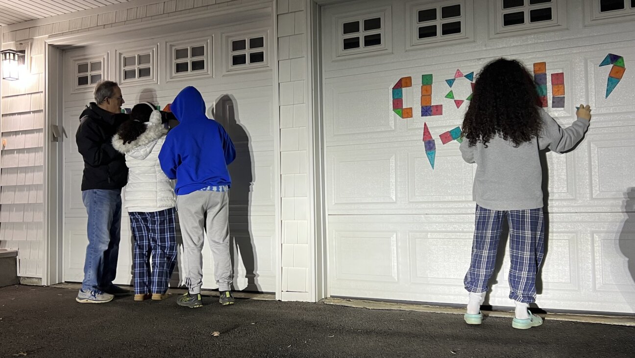 Alan, Shira, Tali and Rami Tuvin rearrange magnets spelling out "WHEN WILL IT END?" into "PITCH CLOCK" for Major League Baseball's opening day and the new rule intended to speed up the games.
