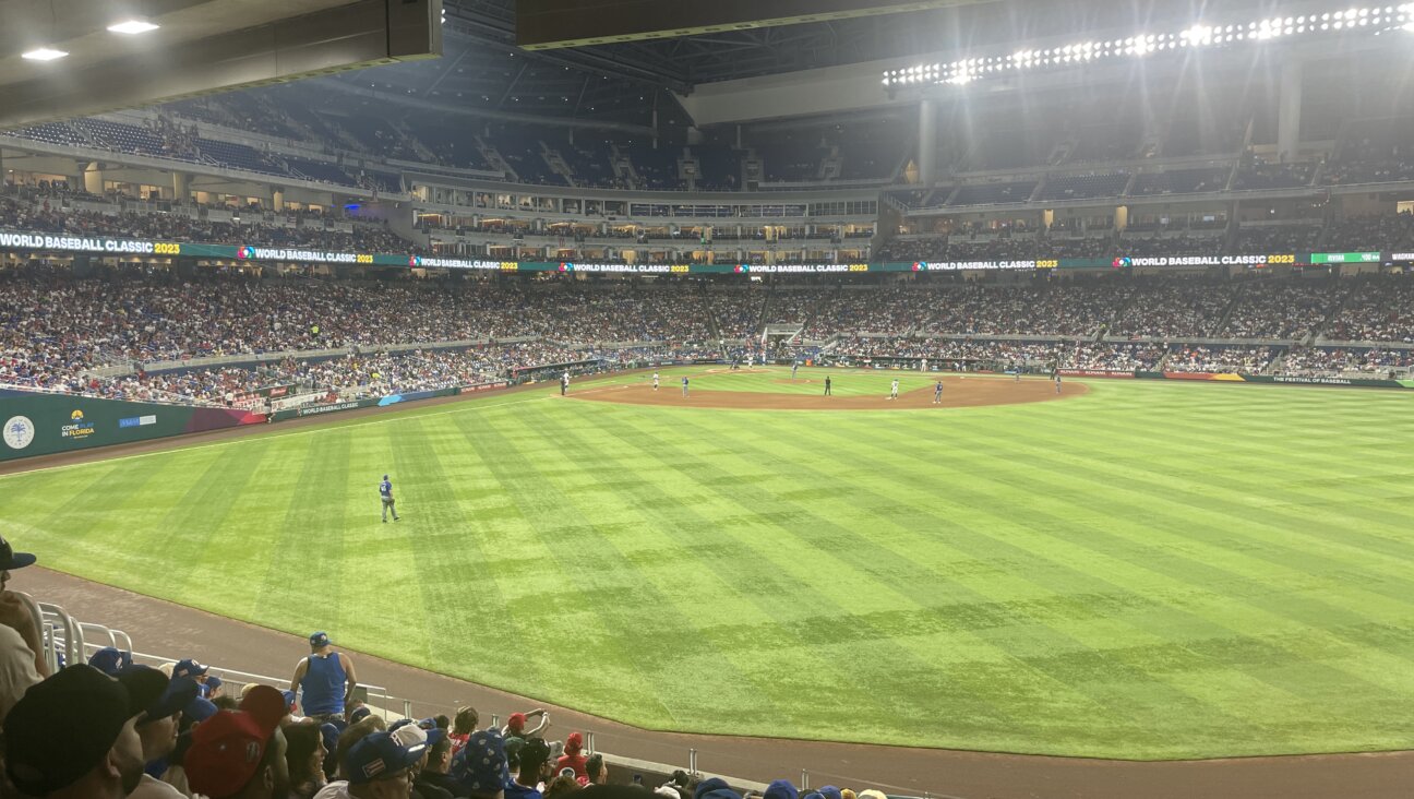 Alex Dickerson stands in the outfield in the World Baseball Classic.