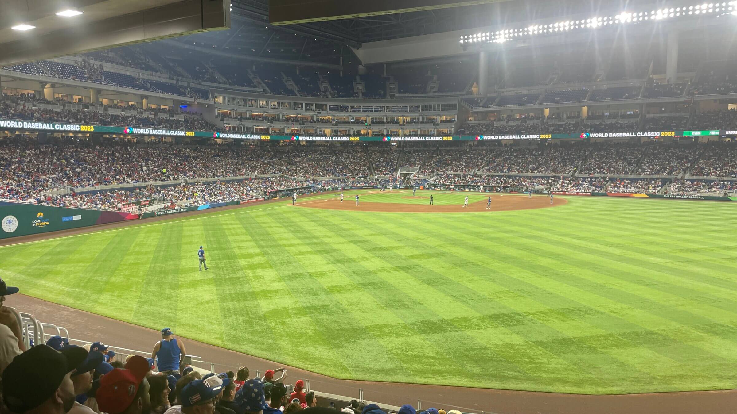 Alex Dickerson stands in the outfield in the World Baseball Classic.