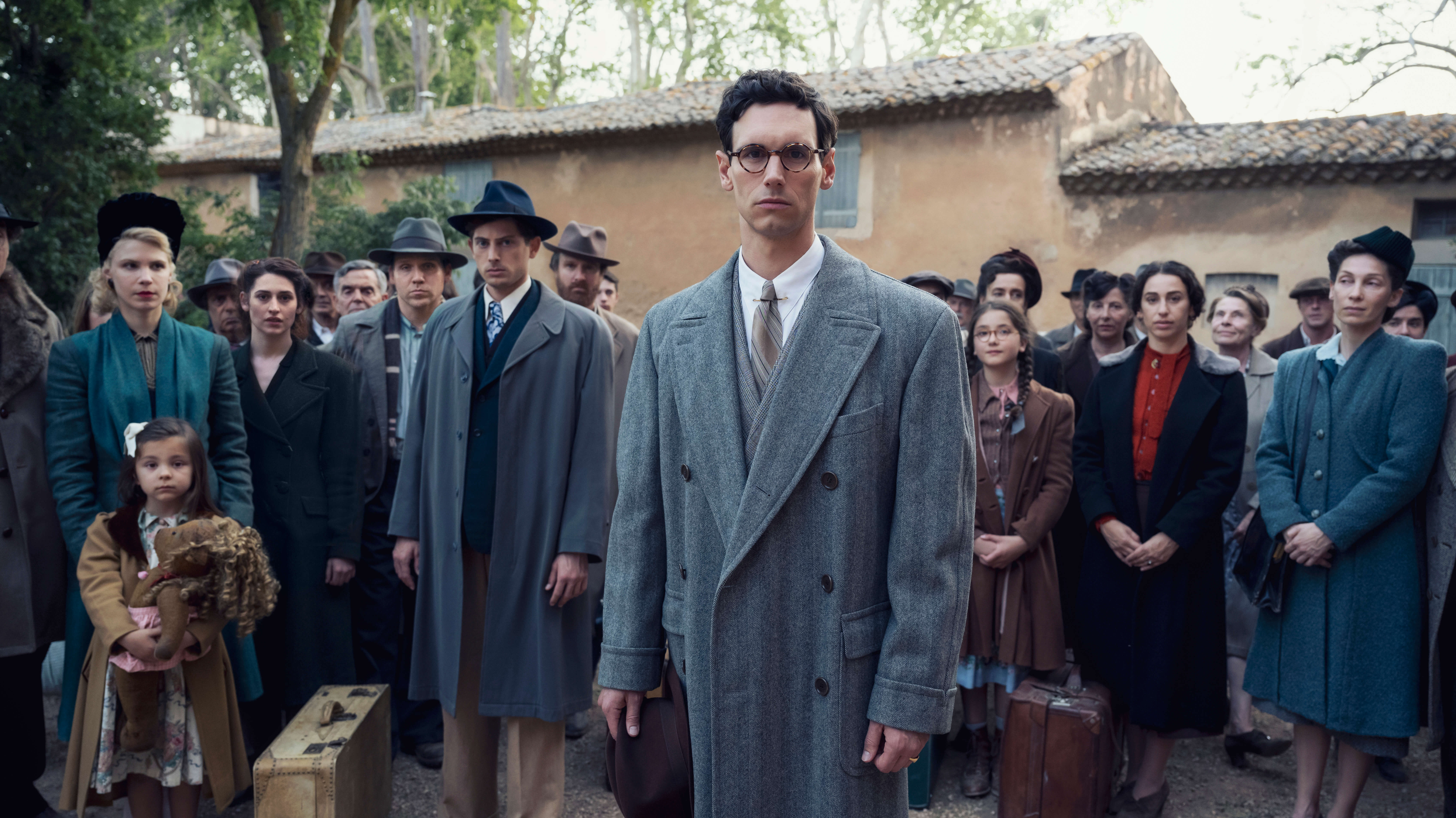 Cory Michael Smith as Varian Fry, Amit Rahav as Thomas Lovegrove and other cast members in <i>Transatlantic</i>.