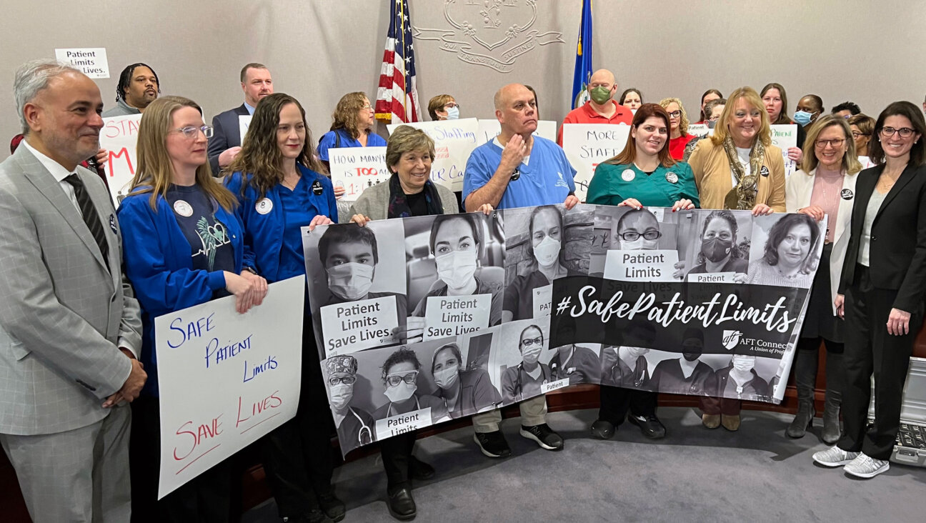 Weingarten, center, with healthcare workers at a safe-staffing briefing at the state Capitol in Hartford, Conn., on Jan. 23.