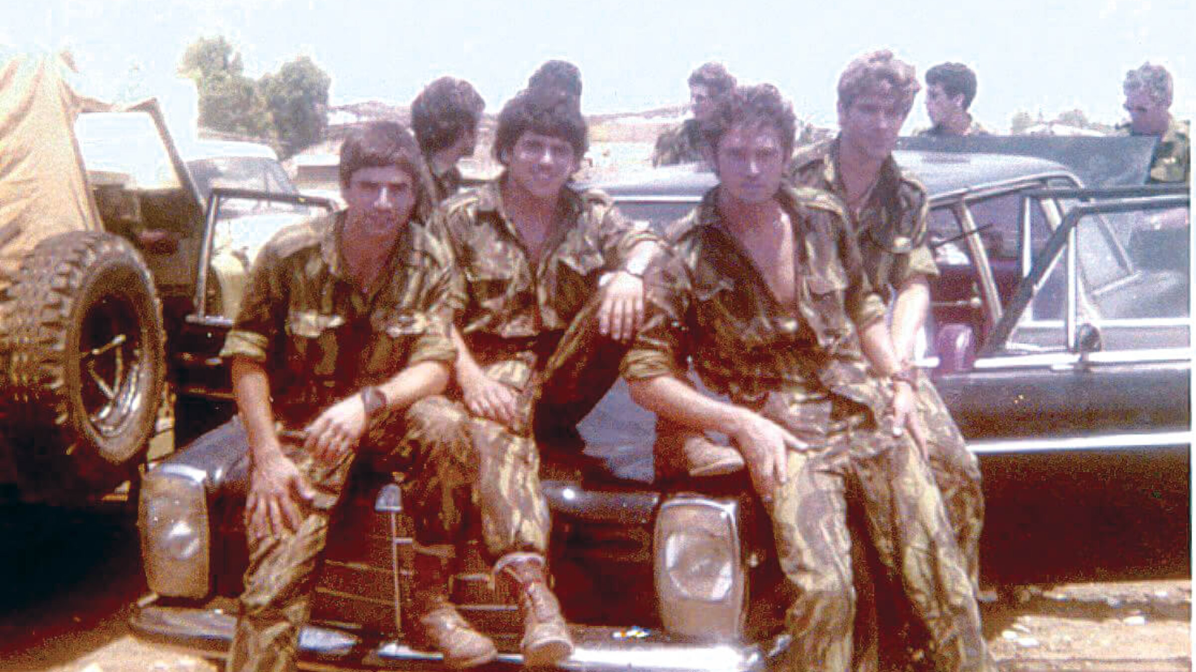 Team Amnon, back in Israel from the Entebbe hostage rescue operation, pose on a black Mercedes car that was a crucial part of the rescue operation,  July 4, 1976. 