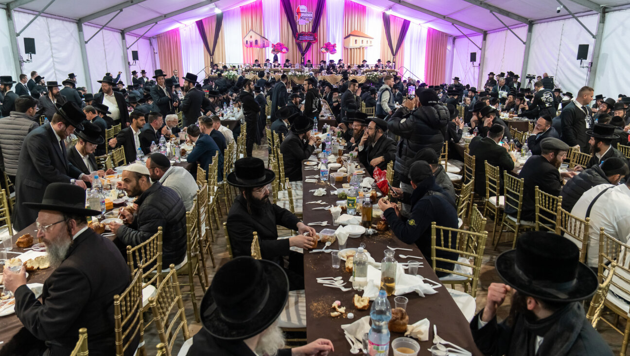 Orthodox Jews gather for a meal in Bodrogkeresztur, Hungary, during an annual pilgrimage to the town that was the home of Rabbi Yeshaya Steiner, also known as Rabbi Shayele. (Barnabas Horvath)