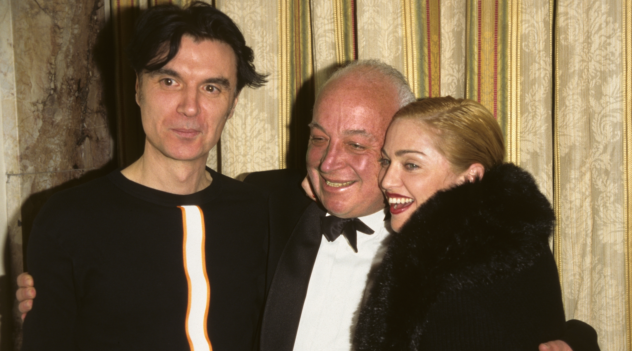 Seymour Stein with David Byrne and Madonna in 1996. (KMazur/WireImage/Getty Images)