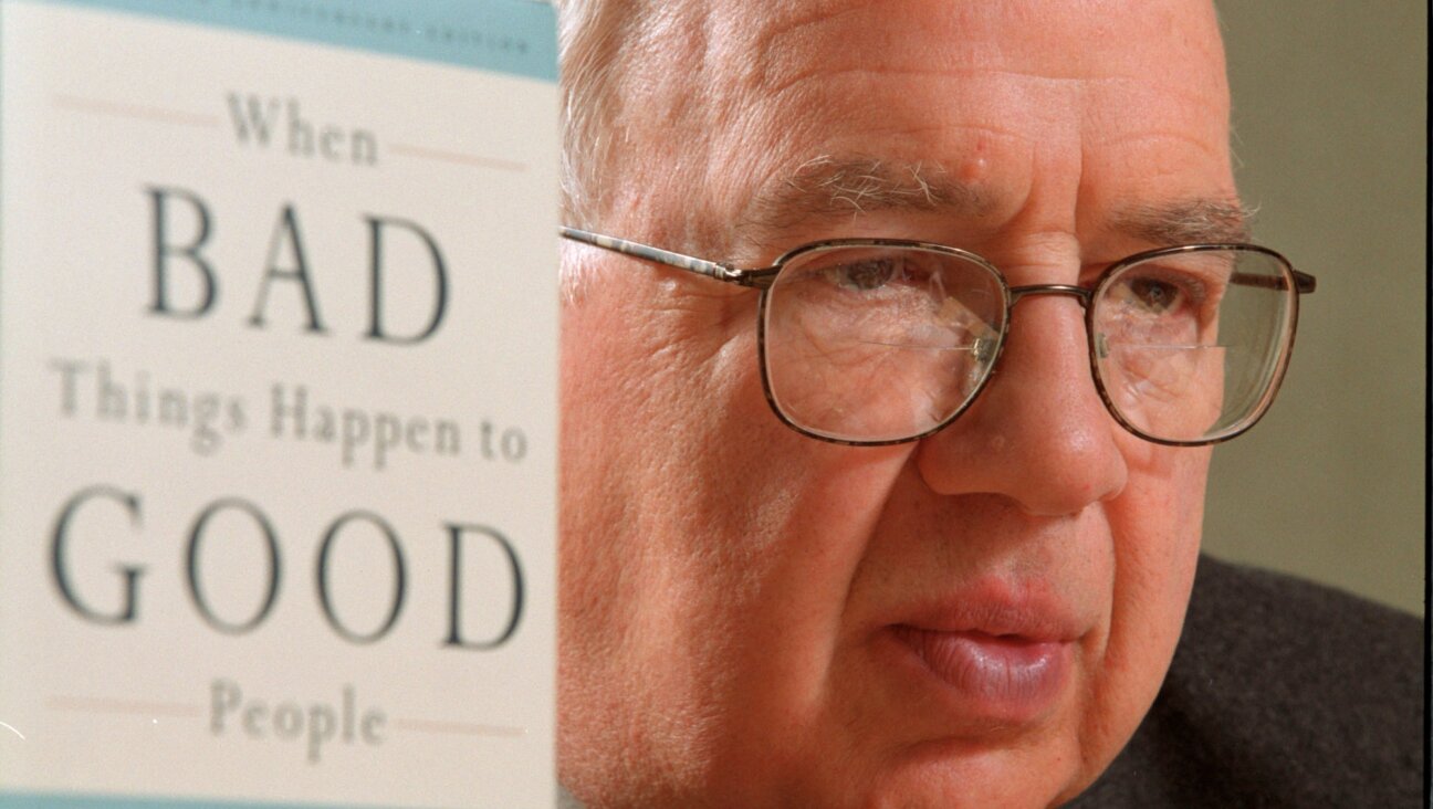 Author and Rabbi Harold Kushner is pictured with his best-selling book, “When Bad Things Happen to Good People,” in 2001. (Ron Bull/Toronto Star via Getty Images)