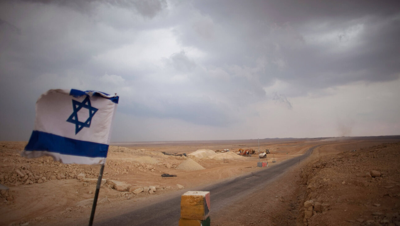 An Israeli flag flies at a checkpoint at the Israeli Egyptian border on February 10, 2011 in Israel. 