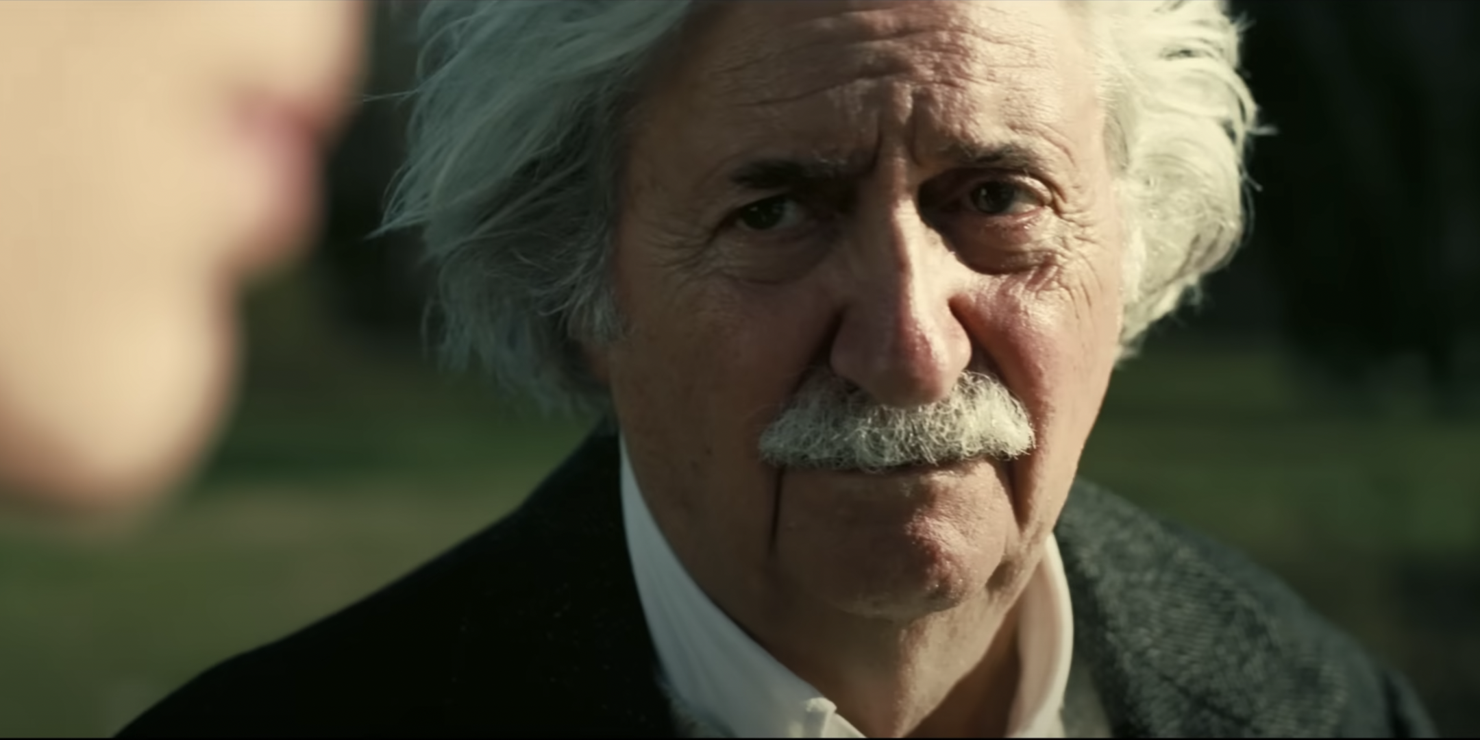 Albert Einstein (Tom Conti) in a scene from the trailer for the historical biopic “Oppenheimer,” about the creation of the atomic bomb. (Screenshot via Universal Pictures)