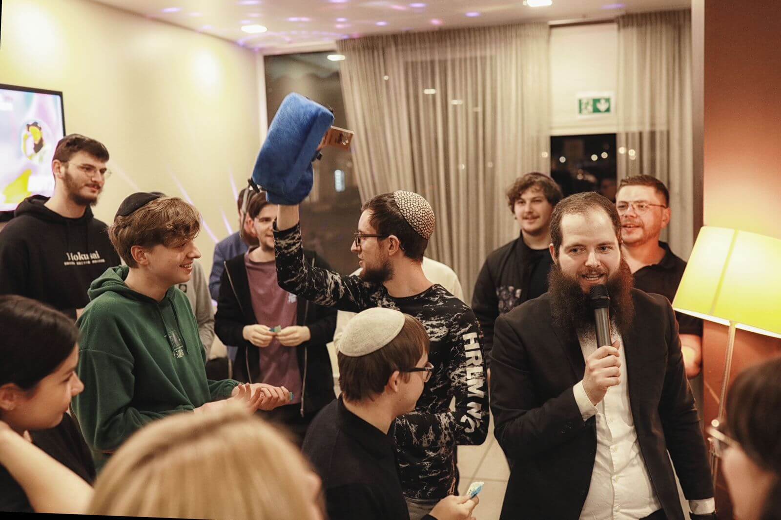 Ukranian Jews in Germany, pictured here at an event, found sanctuary but many aren't sure whether they will stay or return home.