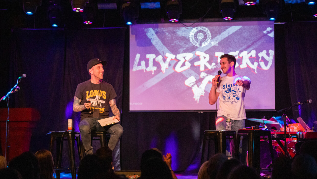 Spike Eskin, left, and Michael Levin at a live recording of the <i>Rights to Ricky Sanchez</i> podcast in April.