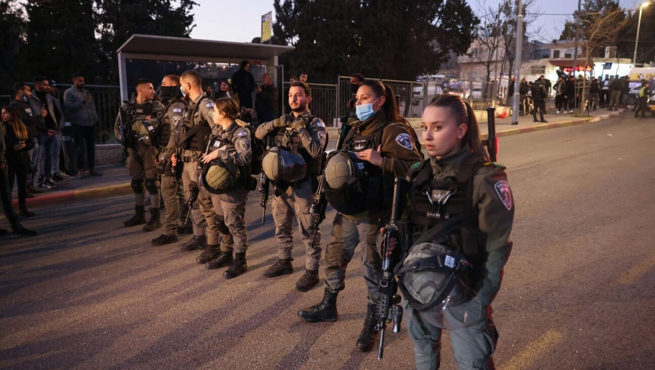 Israeli security forces close-off a street following clashes between Palestinians and Israeli settlers during a visit by far-right lawmaker Itamar Ben Gvir of the Religious Zionism alliance (unseen), in the east Jerusalem neighbourhood of Sheikh Jarrah on February 13, 2022. 