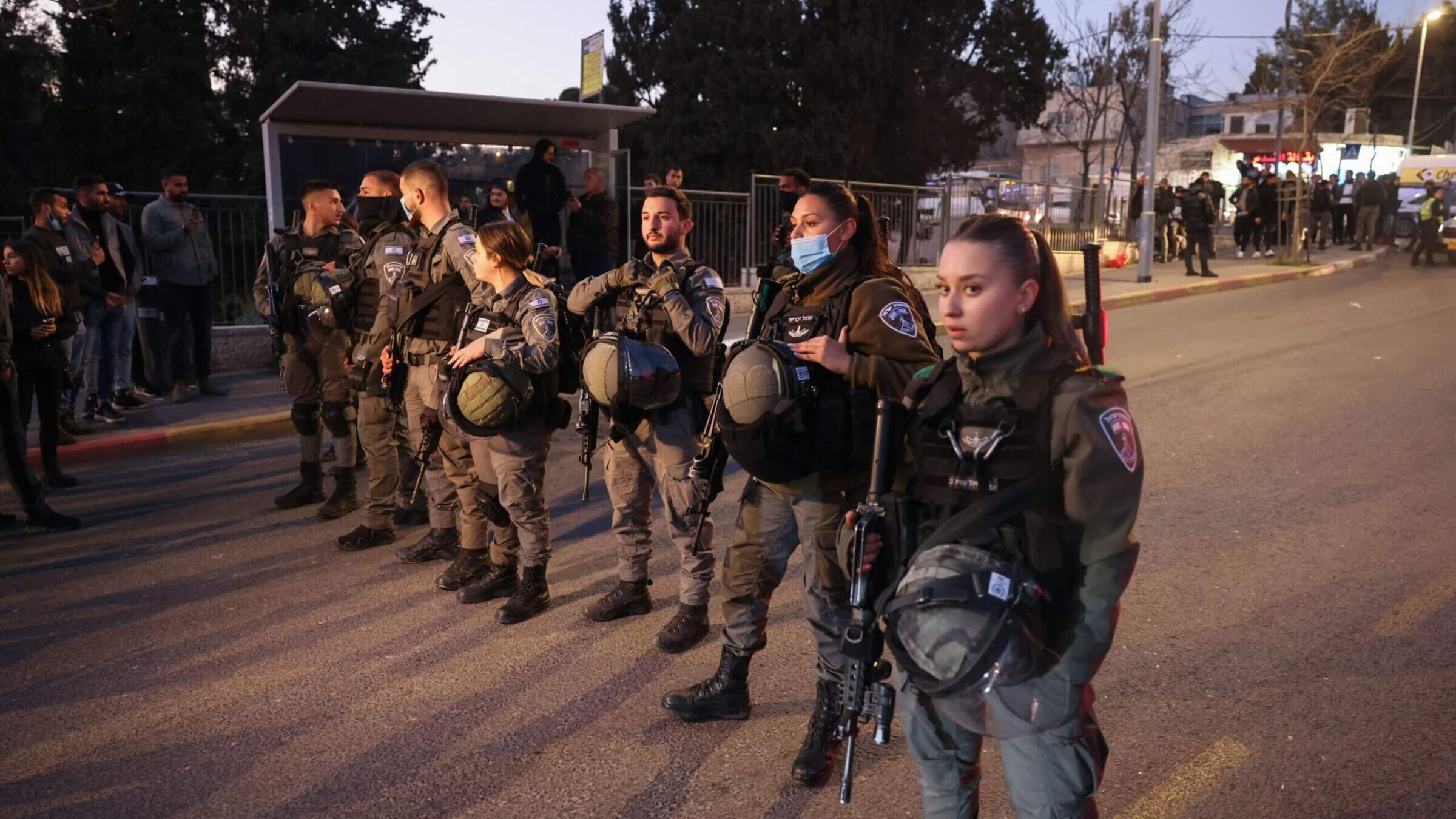 Israeli security forces close-off a street following clashes between Palestinians and Israeli settlers during a visit by far-right lawmaker Itamar Ben Gvir of the Religious Zionism alliance (unseen), in the east Jerusalem neighbourhood of Sheikh Jarrah on February 13, 2022. 