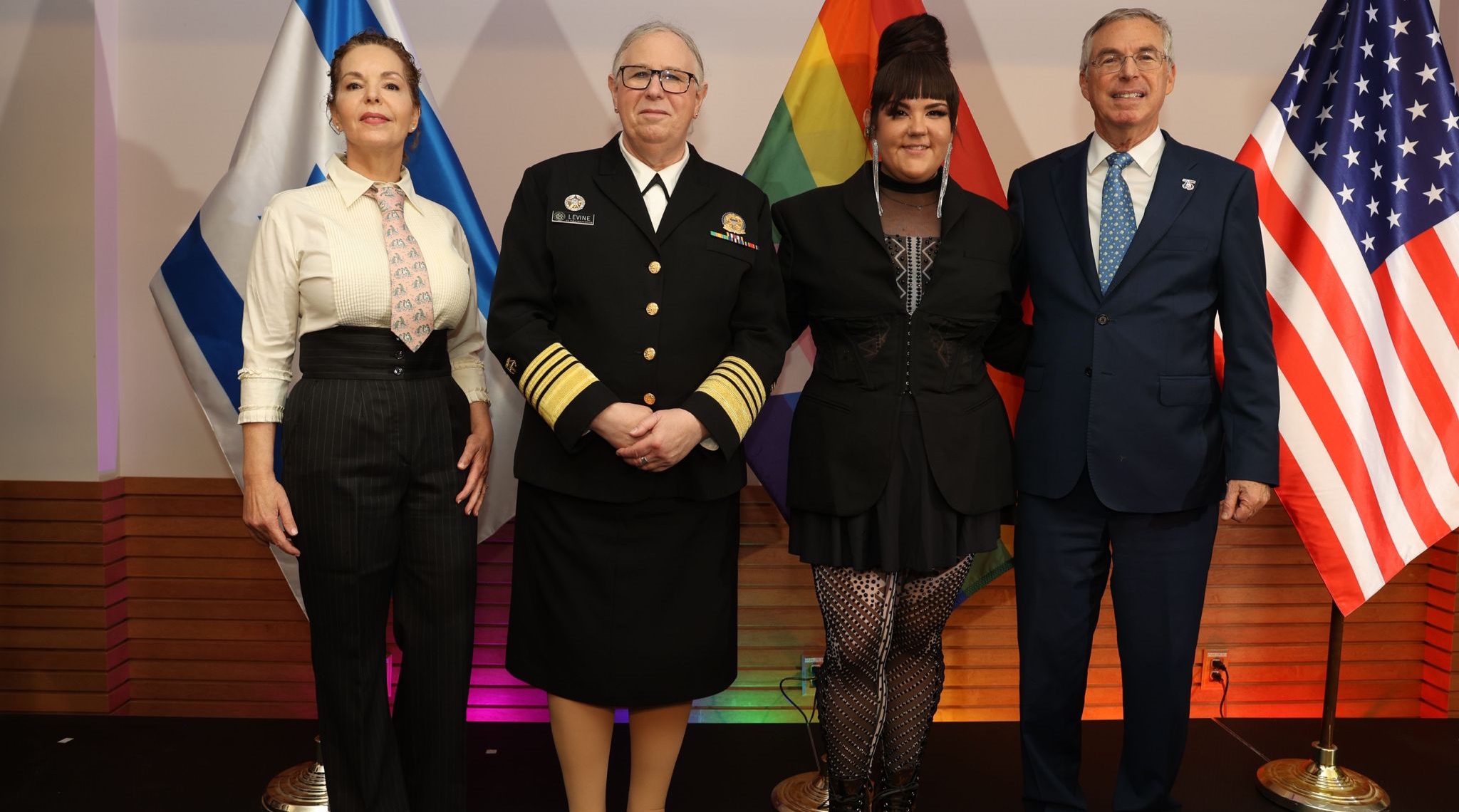 Left to right, Sharon Herzog, U.S. Assistant Secretary of Health Rachel Levine, Netta Barzilai, and Ambassador Michael Herzog pose at a Pride Event at the Israel embassy in Washington, June 29 2023. (Shmulik Almany, Embassy of Israel)