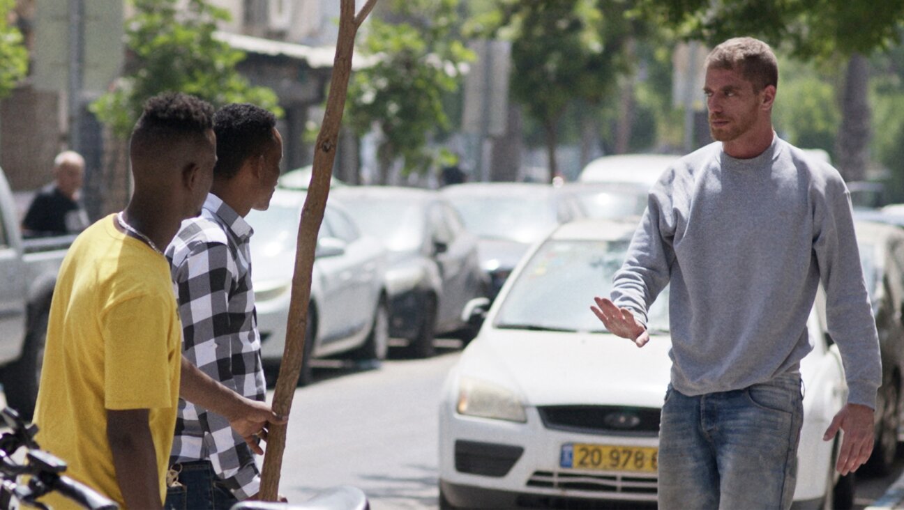 Shlomi Bertonov, right, as Ben in “Concerned Citizen.” (Guy Sahaf)