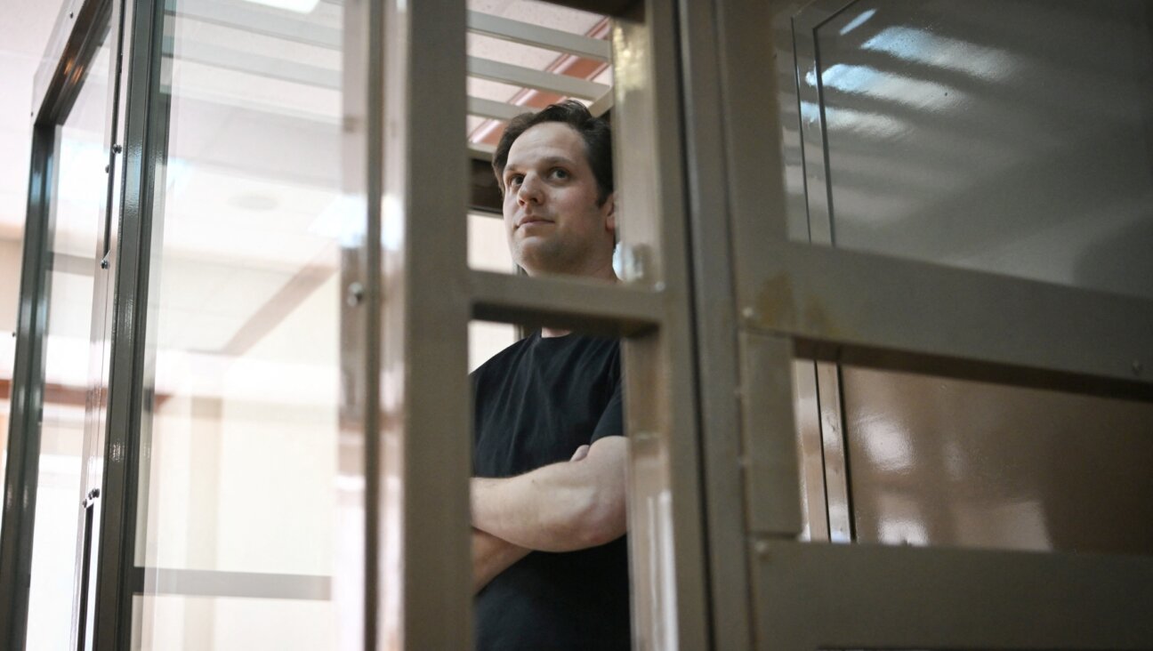 US journalist Evan Gershkovich stands inside a defendants’ cage at Moscow City Court on June 22, 2023. (Photo by NATALIA KOLESNIKOVA/AFP via Getty Images)