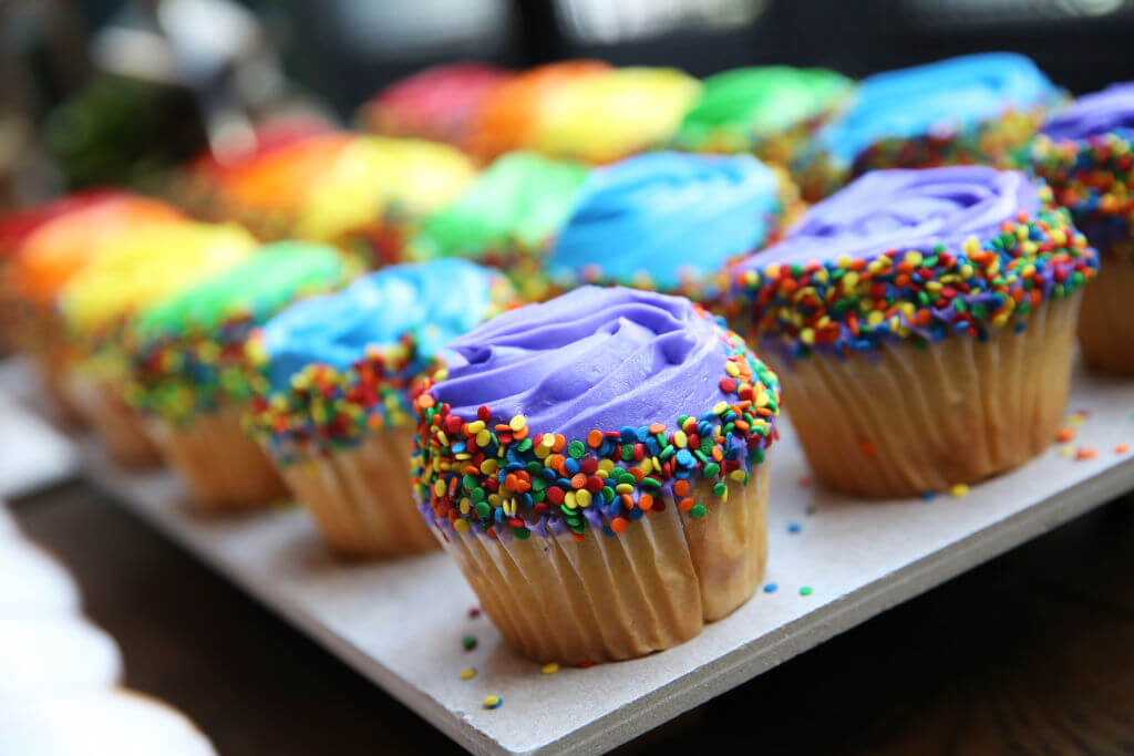 A view of rainbow cupcakes at the Brunch Out With Trevor at Kimpton Hotel Event in New York City.