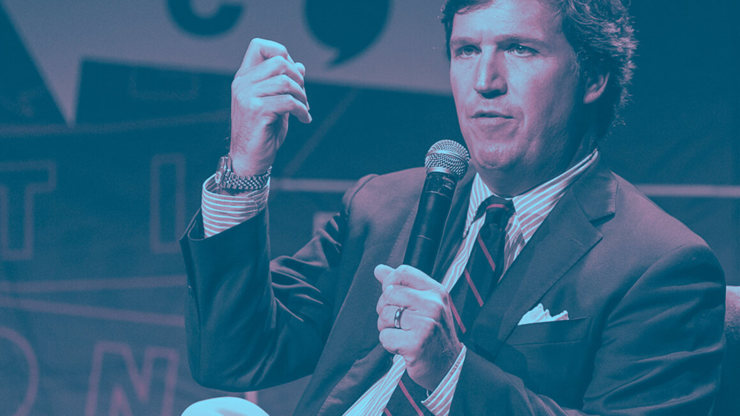 Background: Tucker Carlson speaks onstage during Politicon 2018 at Los Angeles Convention Center.