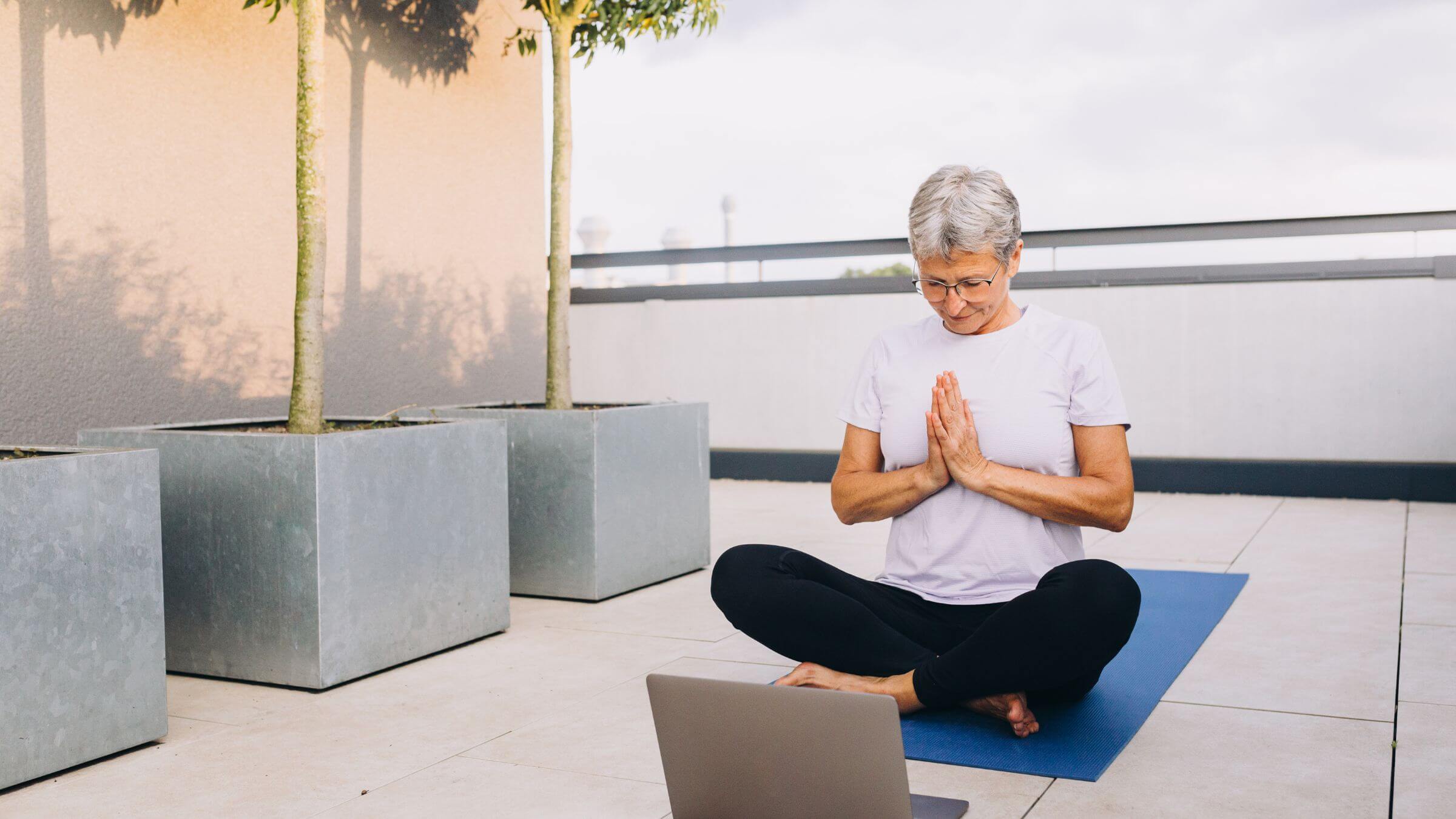 Learning yoga from an online class.