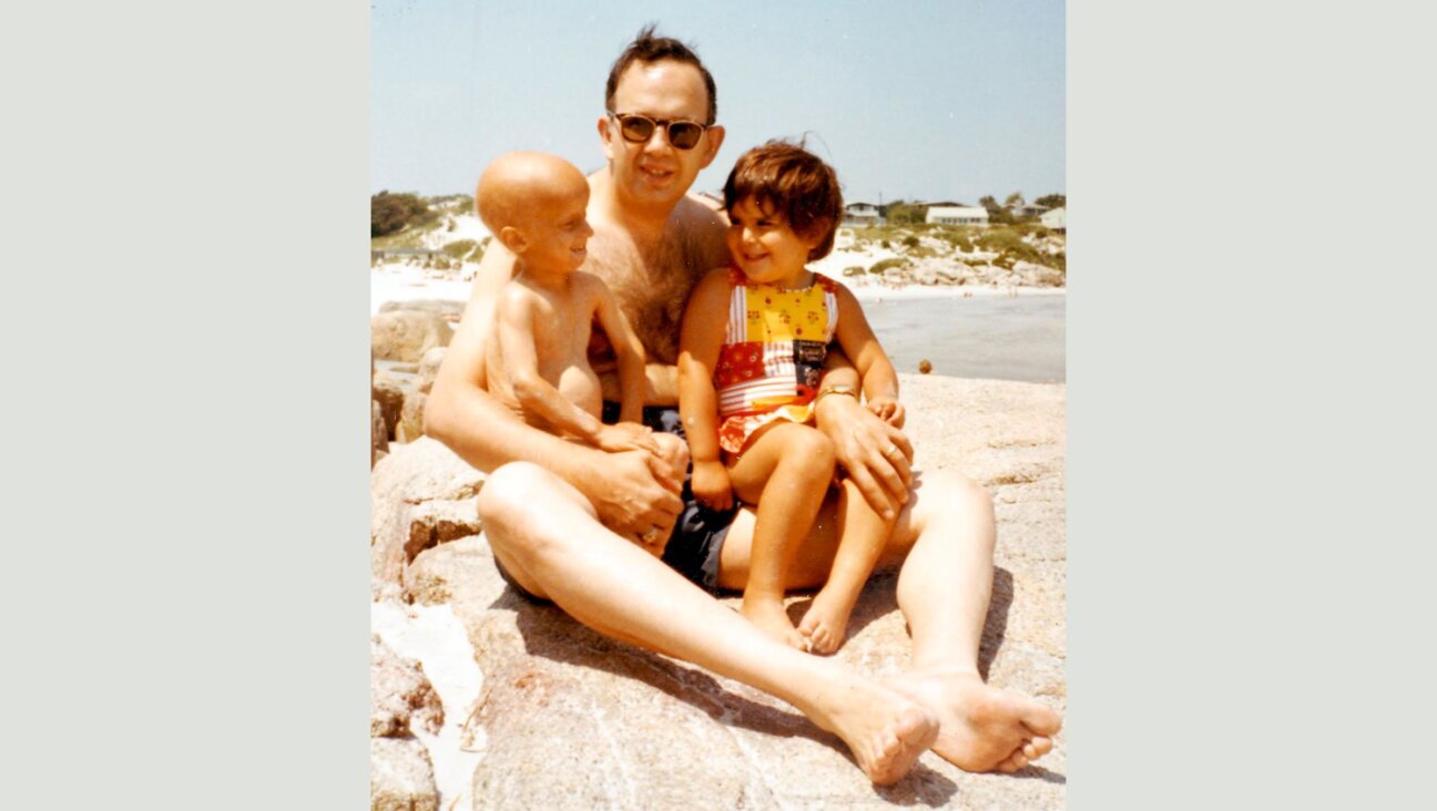 Rabbi Harold Kushner, center, is pictured with his son, Aaron, left, who had a rare disease called progeria, and his daughter Ariel.