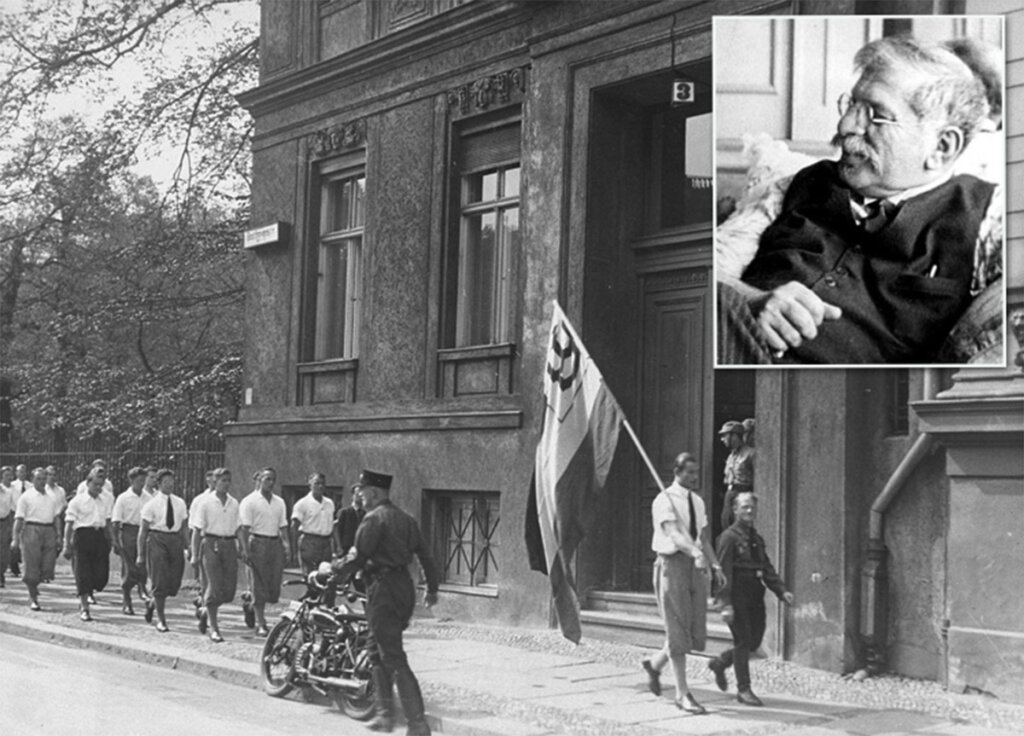 Students organized by the Nazi party in 1933 parade in front of the Institute for Sexual Research, founded by Magnus Hirschfeld, inset. (Wikimedia) 