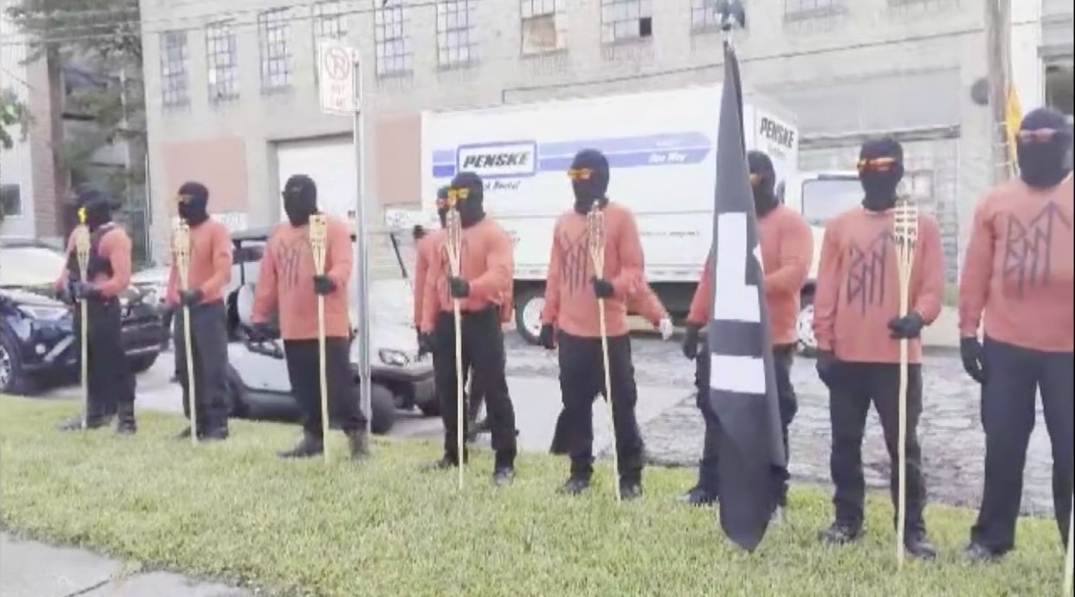 A hate group flies a swastika flag outside an LGBTQ event in downtown Toledo, Ohio, before heading to a nearby Jewish community complex, July 15, 2023. (Screenshot via WTOL11)