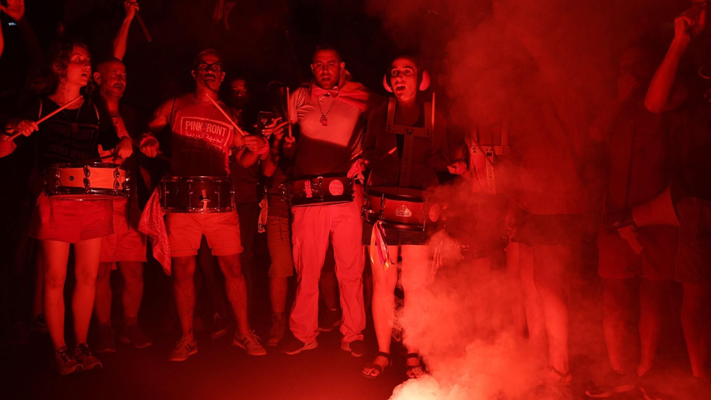 Protesters beat drums as they protest against the Israeli government's judicial overhaul plan in Tel Aviv on July 29, 2023. 