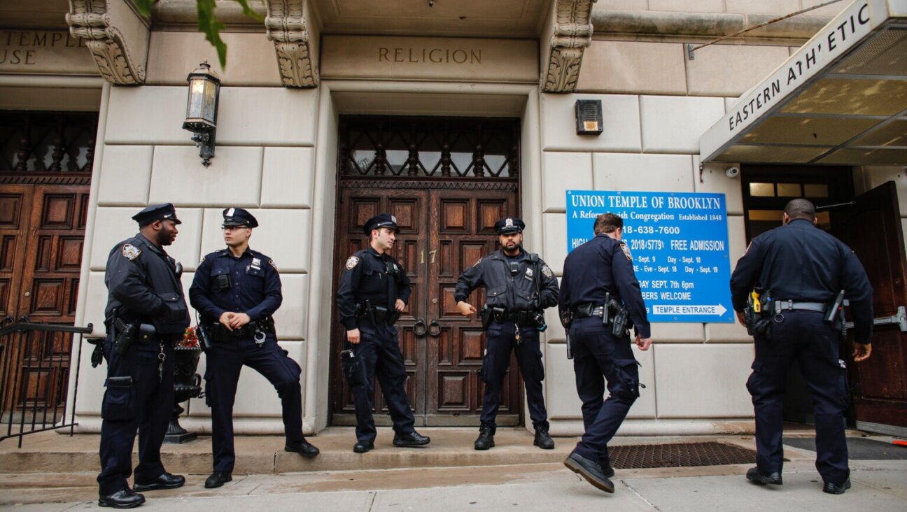 New York City police officers guard the door of Brooklyn’s Union Temple in 2018. (Getty)