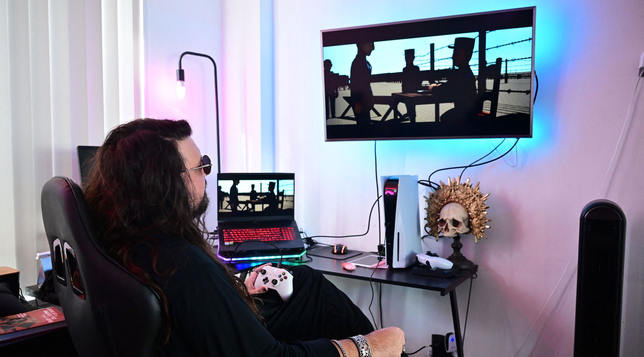 Luc Bernard shows off his video game “The Light in the Darkness,” in which players control a French Jewish family during the Holocaust, Feb. 14, 2023. (Federic J. Brown/AFP via Getty Images)