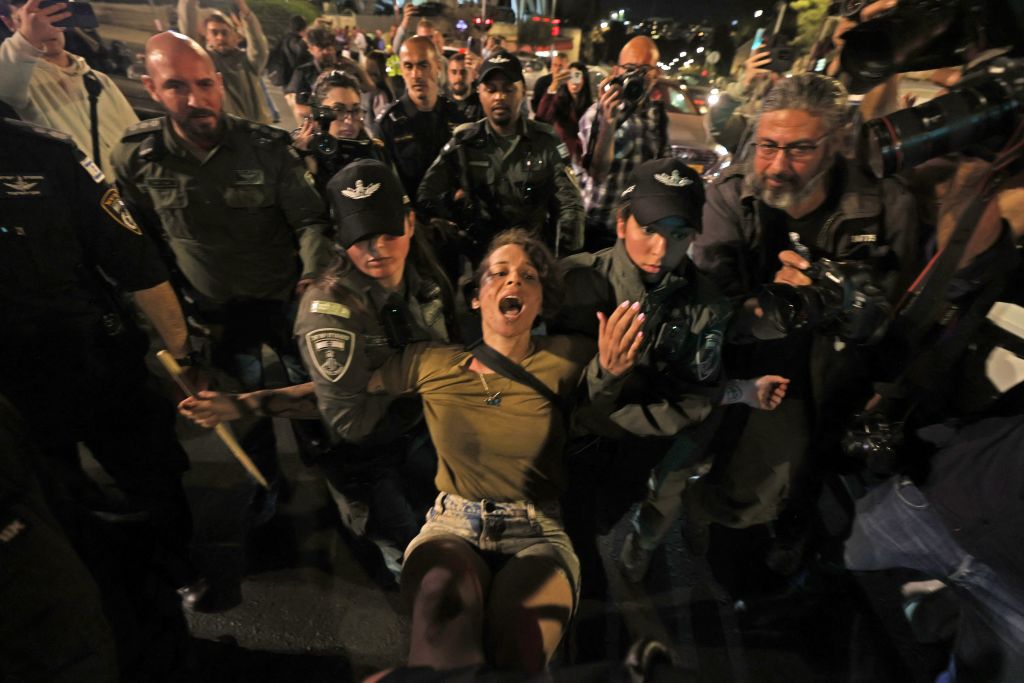 Israeli security forces detain a protester near the prime minister's residence in Jerusalem on March 1, 2023. Similar protests have been happening every Saturday night all year. (Getty)