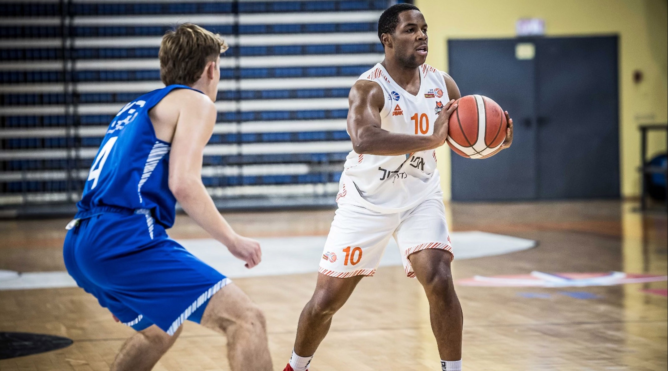 Jared Armstrong, right, playing professional basketball in Israel. (Courtesy of Jared Armstrong)