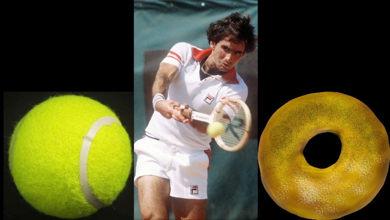 Jewish tennis champion Harold Solomon hits the ball in his match against Argentinian Guillermo Vilas in the 1980 Men's French Open quarterfinals. 